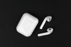 AirPods earphones on a black background